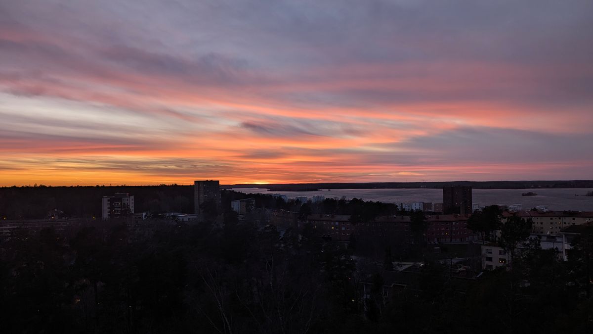 Sunset painting the sky over Stockholm cityscape